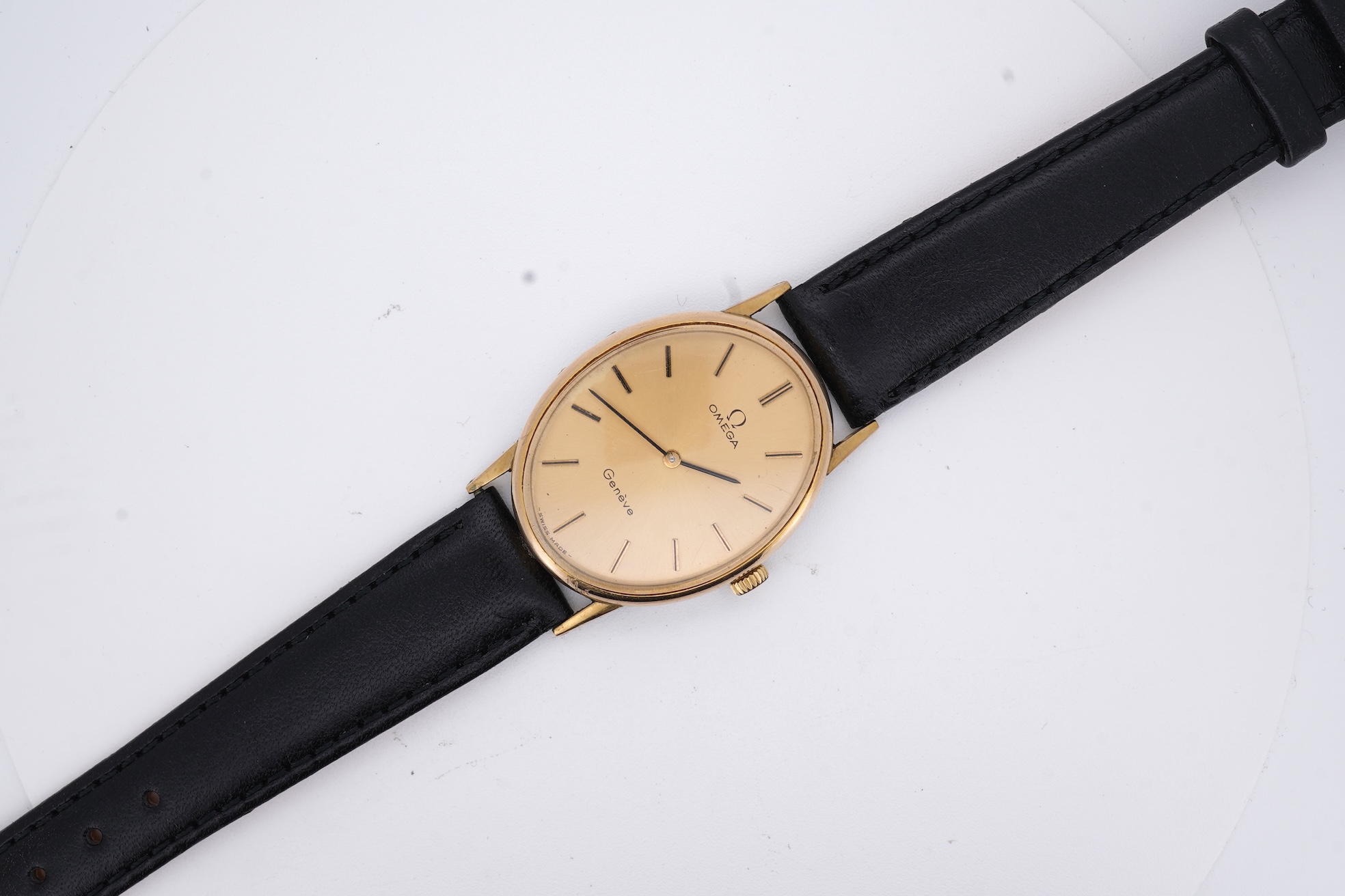 A lady's early 1970's steel and gold plated Omega manual wind wrist watch, with oval dial and baton numerals, case diameter 26mm, movement c.620, on an associated leather strap, with box no papers.